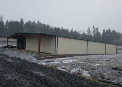 Large steel agricultural building in the snow