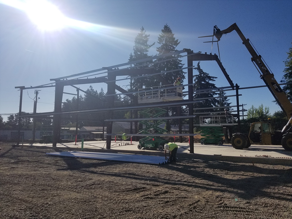 Frame for steel building, crane putting in truss